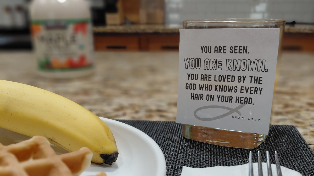 sticky note with Christian inspiration stuck on a morning breakfast glass